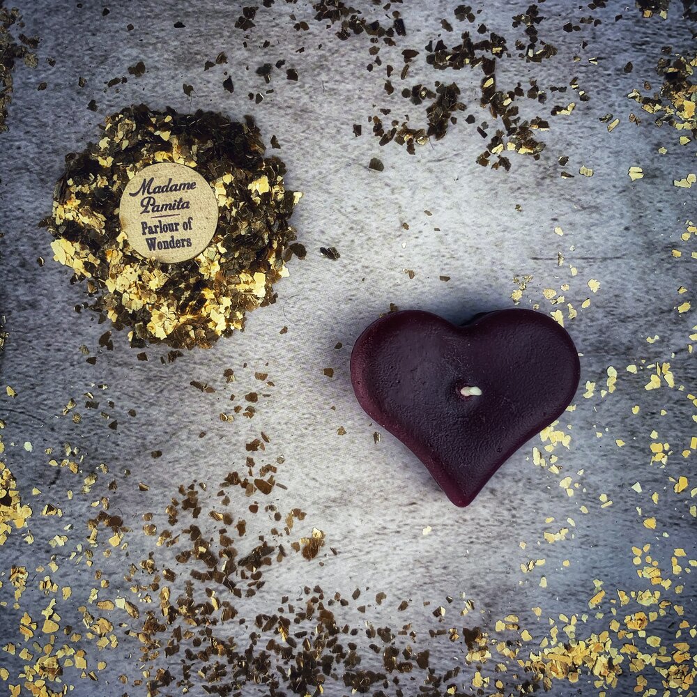 White beeswax mini heart spell candle from Parlour of Wonders, used for love influence and emotional healing magic.