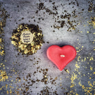 White beeswax mini heart candle from Parlour of Wonders, used for love influence and emotional healing magic.