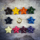 White beeswax Sister Star Spell Candle by Parlour of Wonders, featuring a star design for protection and spiritual magic.