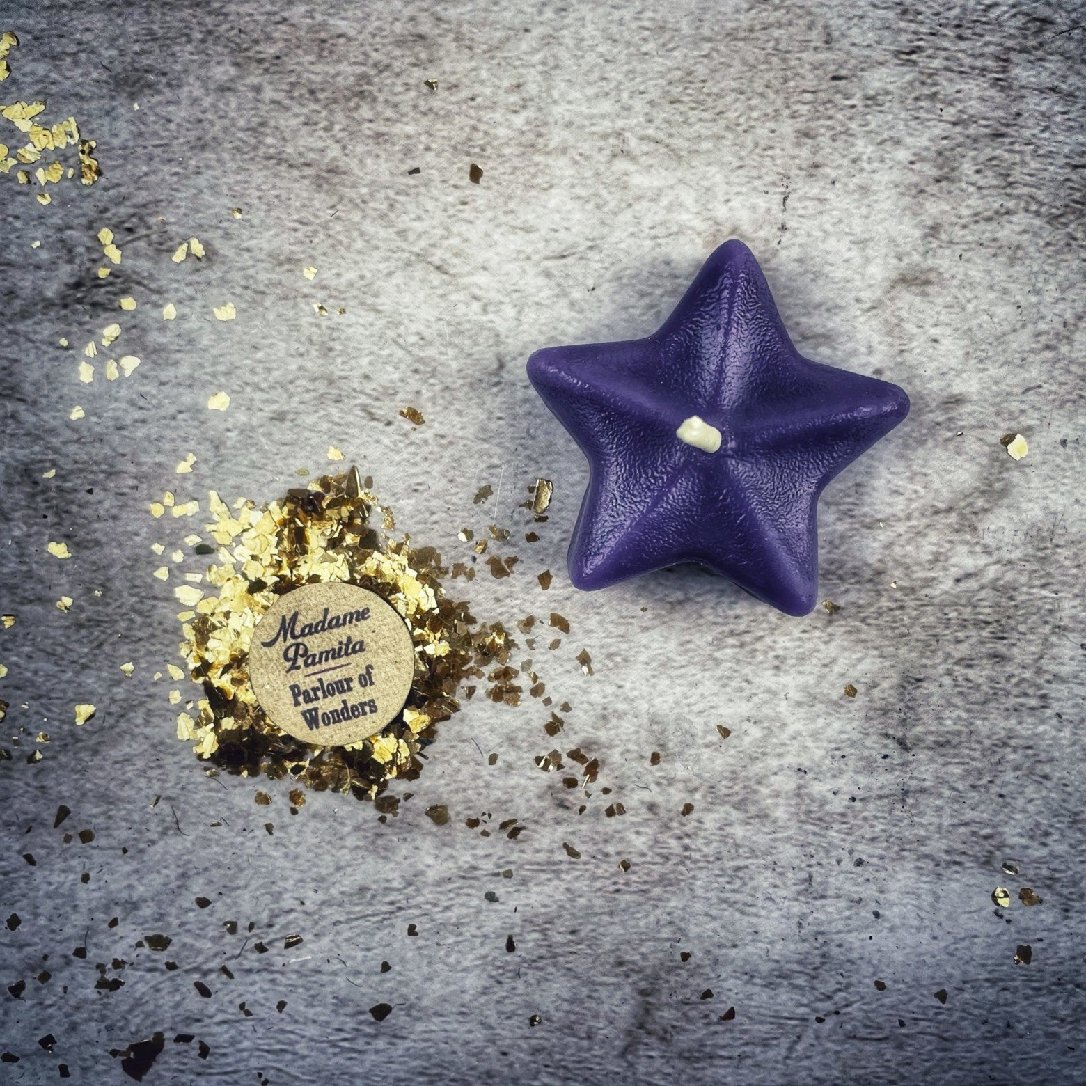 White beeswax Sister Star Spell Candle by Parlour of Wonders for protection and spiritual power magic, featuring a star-shaped design.