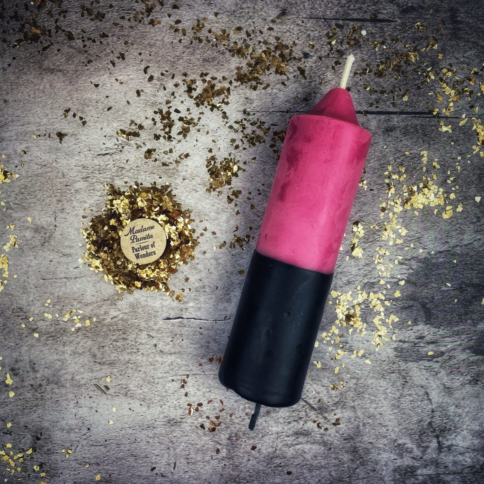 Yellow and black beeswax candle from Parlour of Wonders for protection and curse reversal magic, featuring double-action reversing spell design.