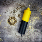 Yellow and black beeswax double action reversing spell candle by Parlour of Wonders, used for protection and curse reversal magic.