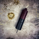Yellow and black beeswax candle with double action reversing spell, designed for protection and curse reversal magic.
