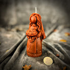 Yellow beeswax Lada Motanka spell candle by Parlour of Wonders, featuring traditional design for blessings, love, and protection.