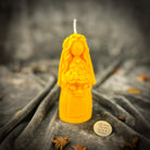 Yellow beeswax Lada Motanka spell candle by Parlour of Wonders, featuring traditional design for blessings, love, and protection.