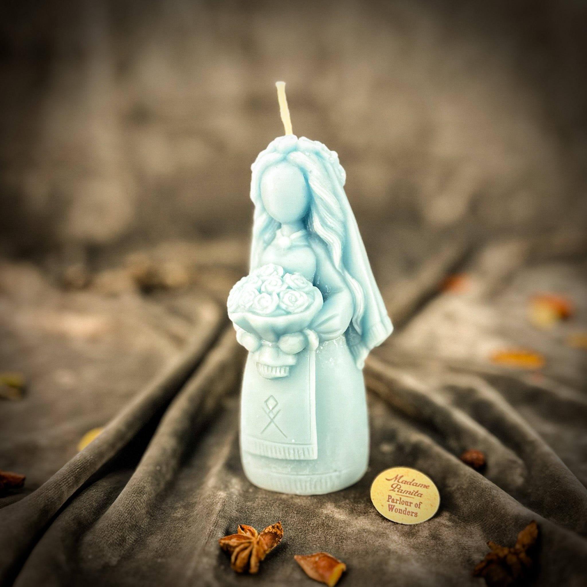 Yellow beeswax Lada Motanka spell candle by Parlour of Wonders, featuring traditional design for blessings, love, and protection.