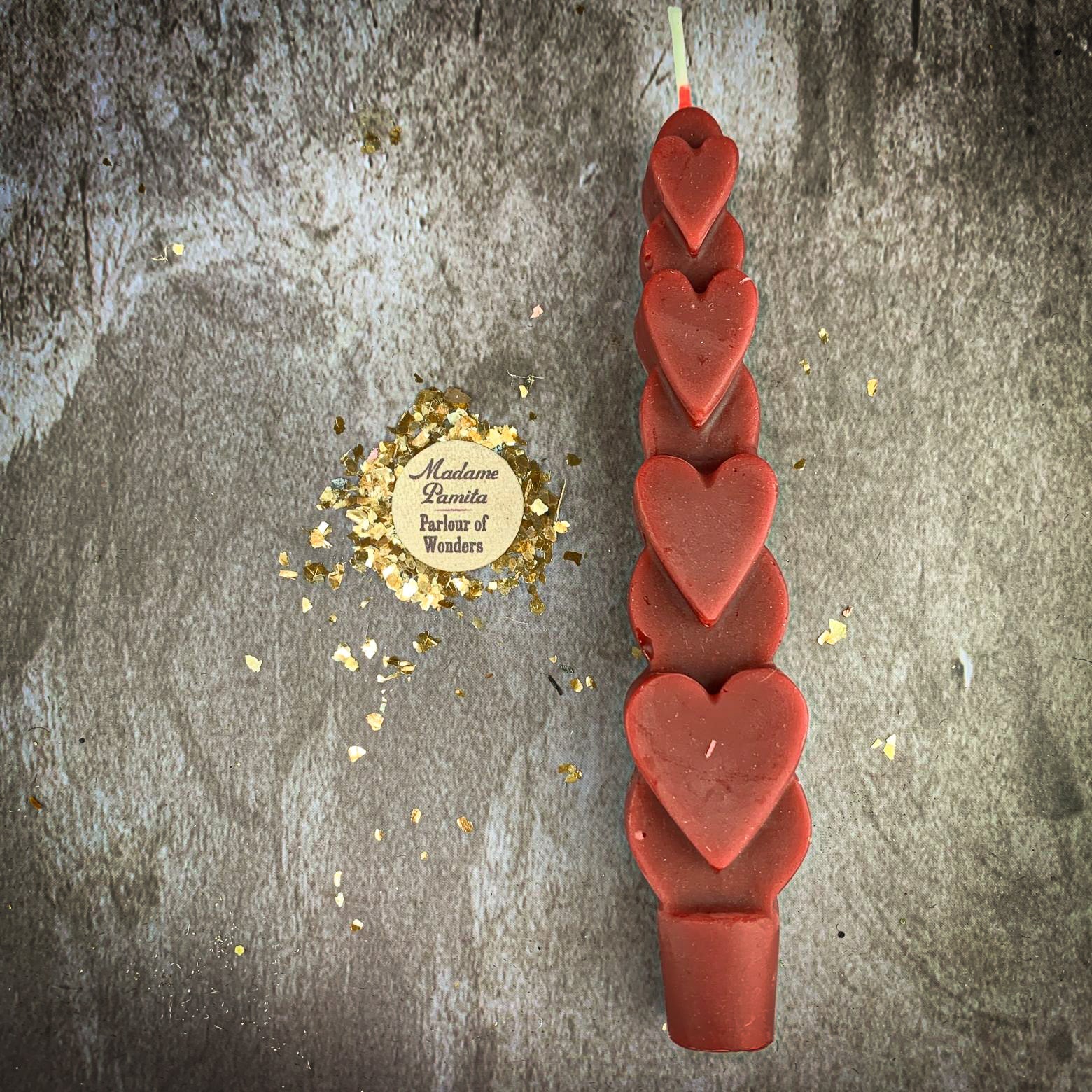 Yellow beeswax Love Spell Heart Taper Candle by Parlour of Wonders, designed for romance and attraction magic.