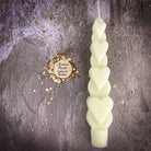 Yellow beeswax love spell heart taper candle by Parlour of Wonders, designed for romance and attraction magic.