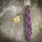 Yellow beeswax Love Spell Heart Taper Candle by Parlour of Wonders for romance and attraction magic, with a heart-shaped design.