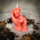 Yellow beeswax candle featuring a mother and child design, symbolizing protection, fertility, and family blessings.