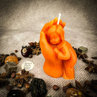 Yellow beeswax mother and child spell candle with protective and fertility symbols, crafted by Parlour of Wonders.