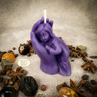 Beeswax candle featuring a mother and child design, symbolizing protection, fertility, and family blessings. Parlour of Wonders.