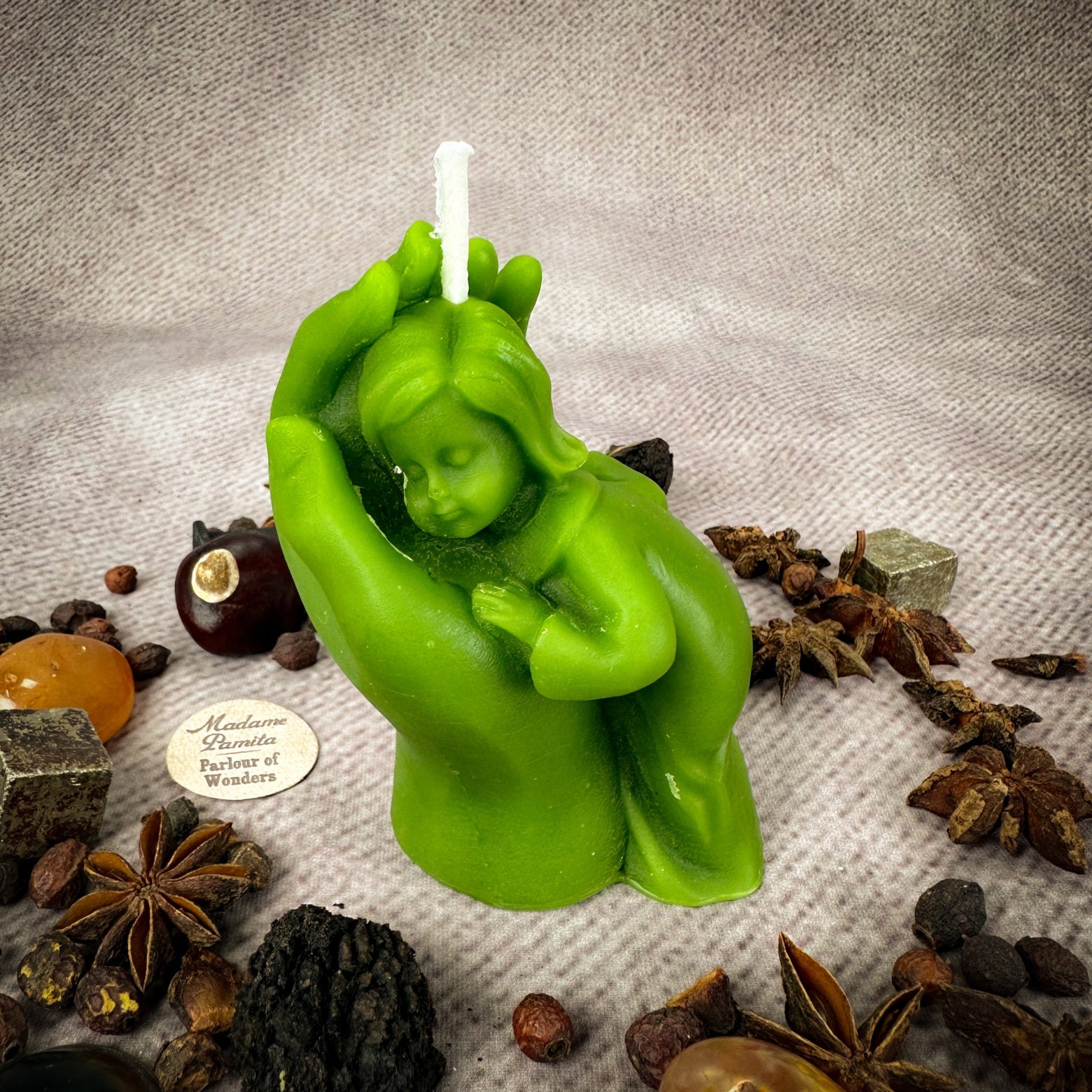 Yellow beeswax mother and child spell candle with protection, fertility symbols, and family blessing imagery.