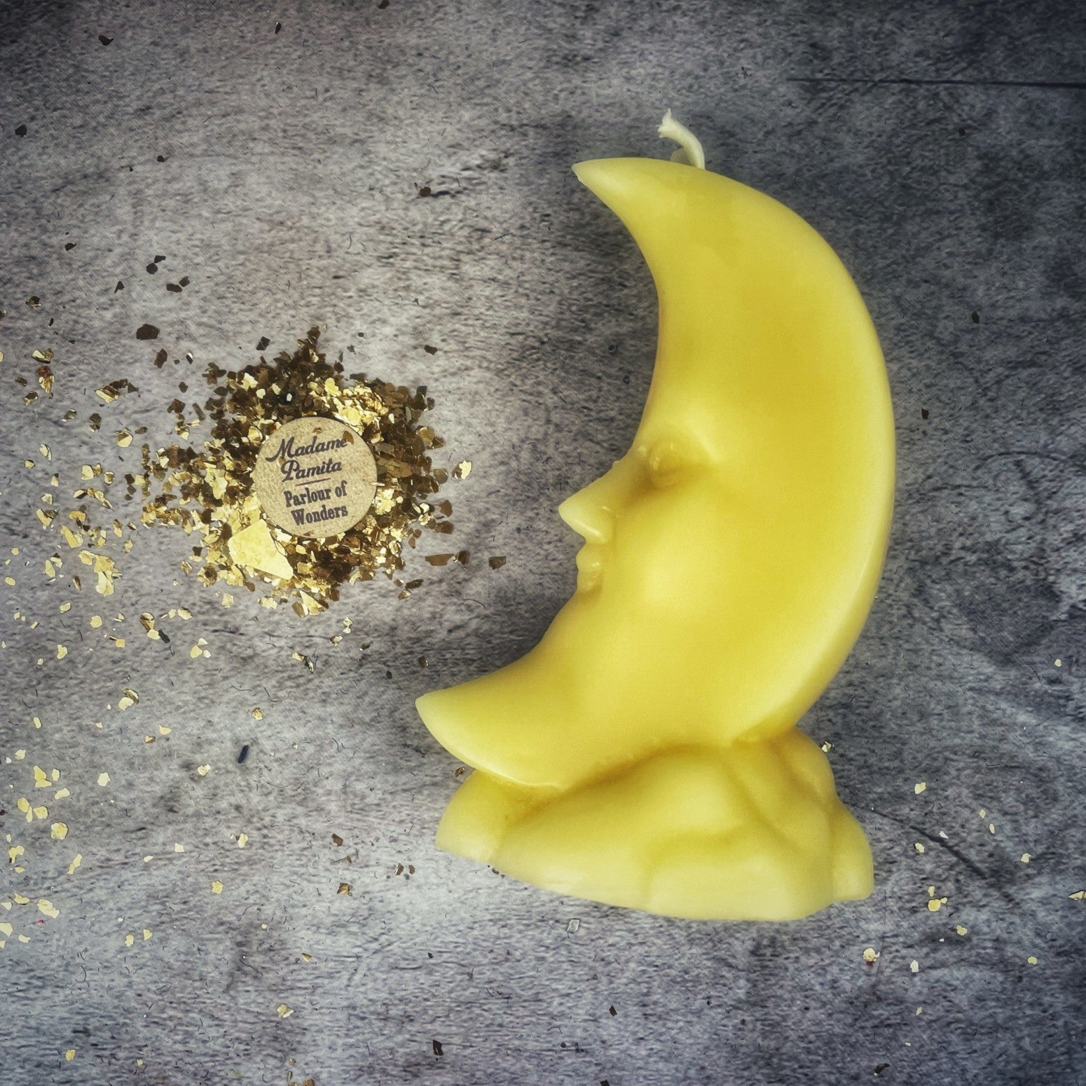 Yellow beeswax crescent moon spell candle by Parlour of Wonders, featuring lunar magic and manifestation symbolism.