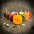Beeswax Lucky Dice Spell Candle by Parlour of Wonders with yellow wax, symbolizing gambling luck and good fortune.