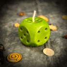 Yellow beeswax candle with lucky dice design by Parlour of Wonders, promoting gambling luck and good fortune.