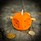 Yellow beeswax candle with lucky dice design, symbolizing gambling luck and good fortune, by Parlour of Wonders.
