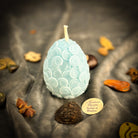 Parlour of Wonders beeswax nest egg spell candle in yellow for financial security and savings, featuring a natural beeswax finish.