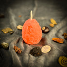 Yellow beeswax nest egg spell candle by Parlour of Wonders, symbolizing savings and financial security.