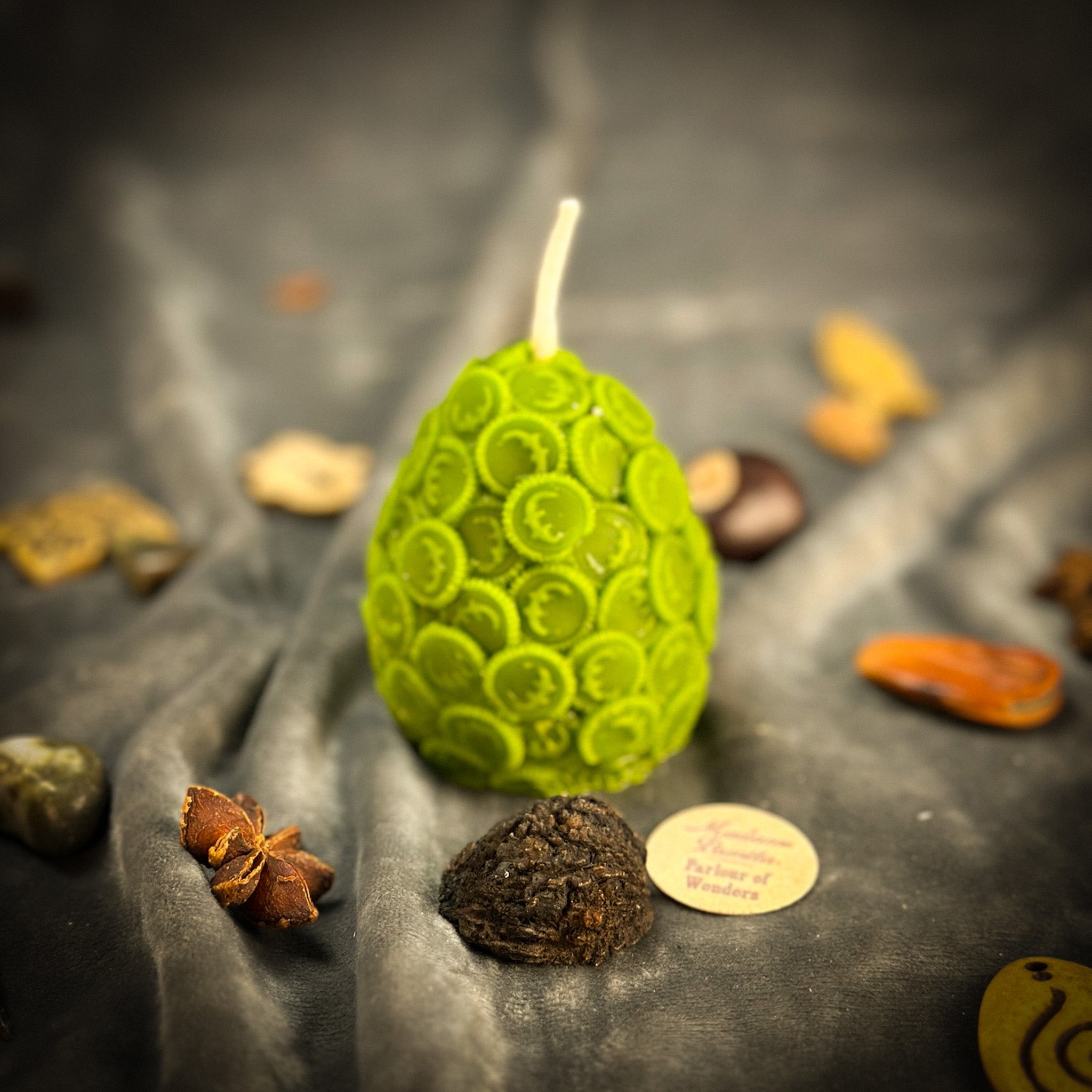 Yellow beeswax nest egg candle by Parlour of Wonders, symbolizing savings and financial security, with intricate design details.