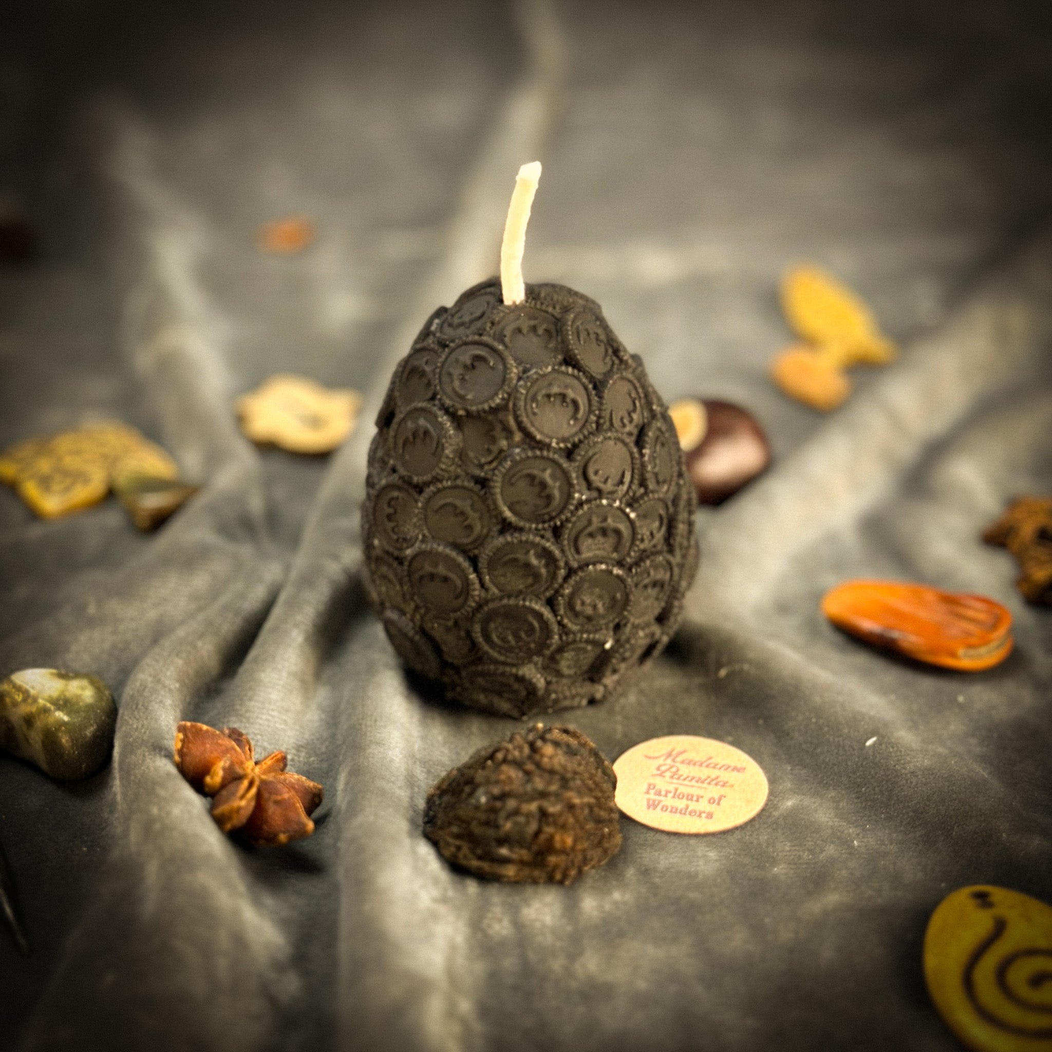 Yellow beeswax nest egg spell candle by Parlour of Wonders symbolizing savings and financial security.