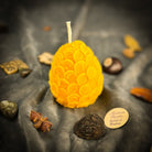 Yellow beeswax nest egg spell candle from Parlour of Wonders for financial security and savings, featuring a natural beeswax design.