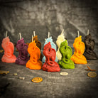 Yellow beeswax candle featuring a carved dragon design, symbolizing protection, power, and guardian magic for spiritual defense.