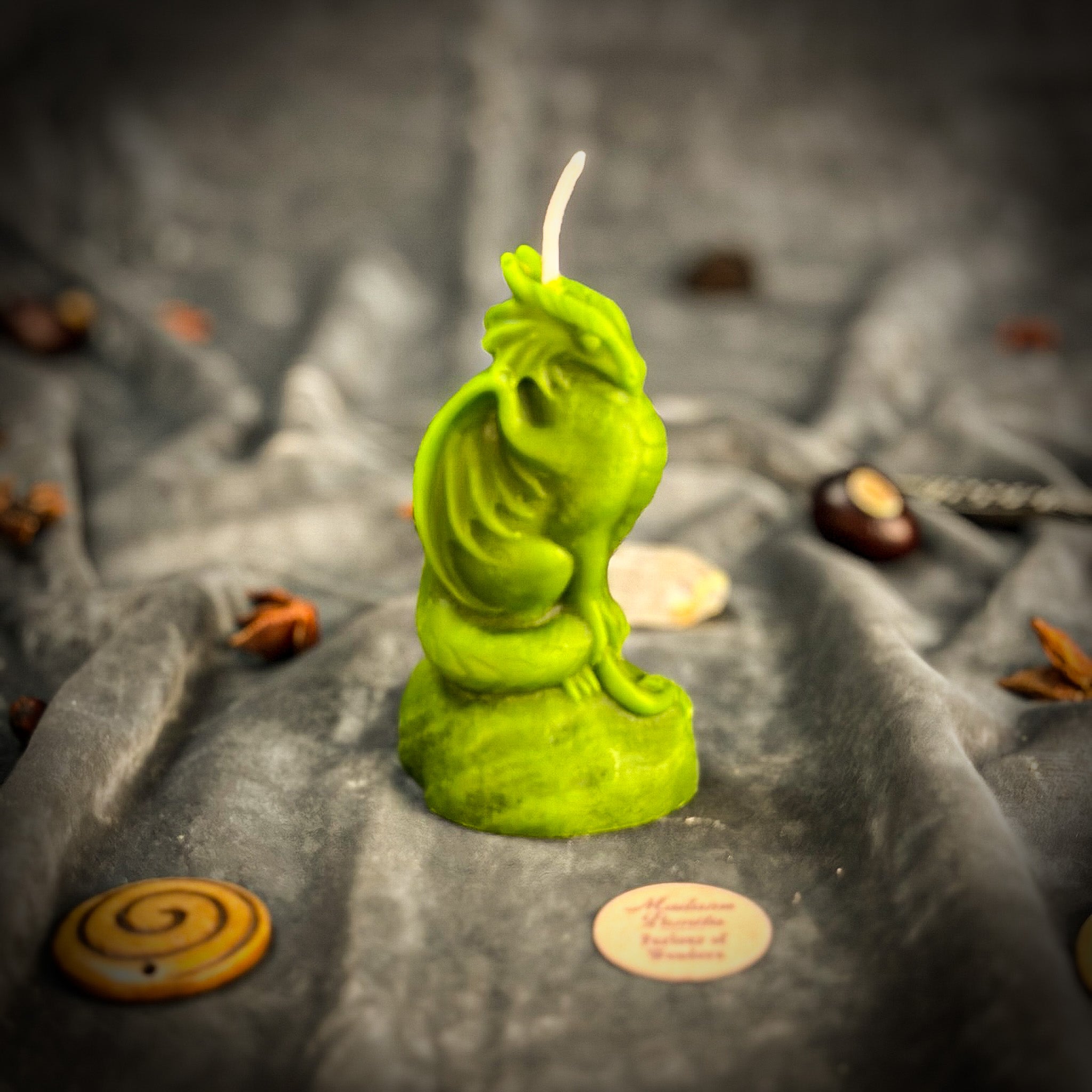 Yellow beeswax candle featuring a carved dragon design, symbolizing protection, power, and guardian magic.