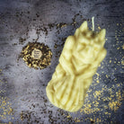 Yellow beeswax candle featuring a gargoyle protector design, used for guarding and protection magic by Parlour of Wonders.