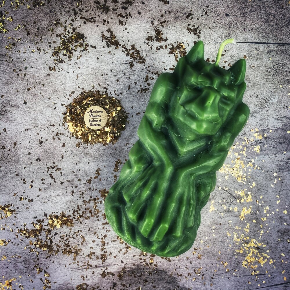 Yellow beeswax candle featuring a gargoyle protector design, used for guardian and protection magic by Parlour of Wonders.