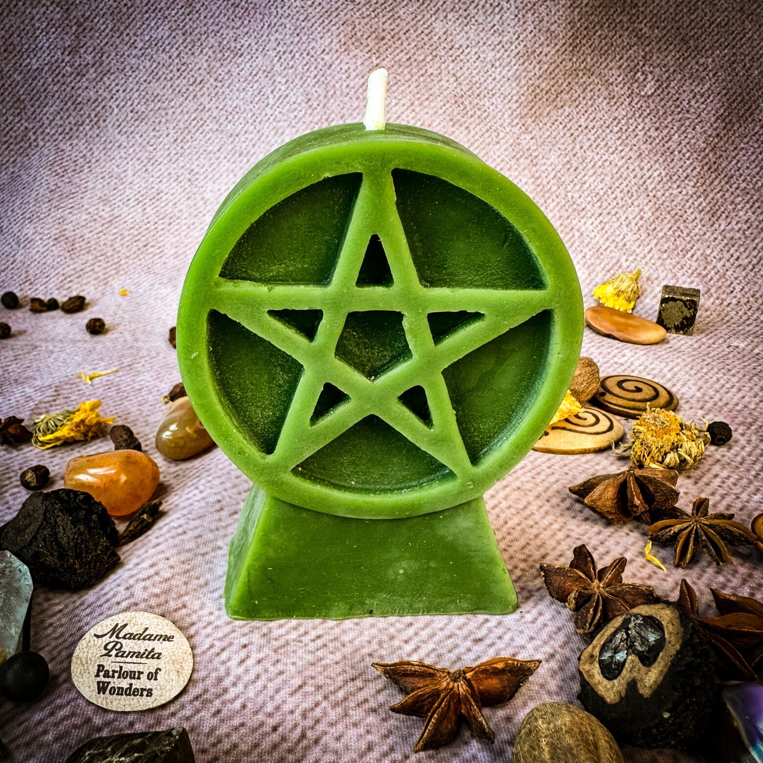 Yellow beeswax candle with pentacle of protection symbol, representing spiritual safety and the five elements for spell casting.