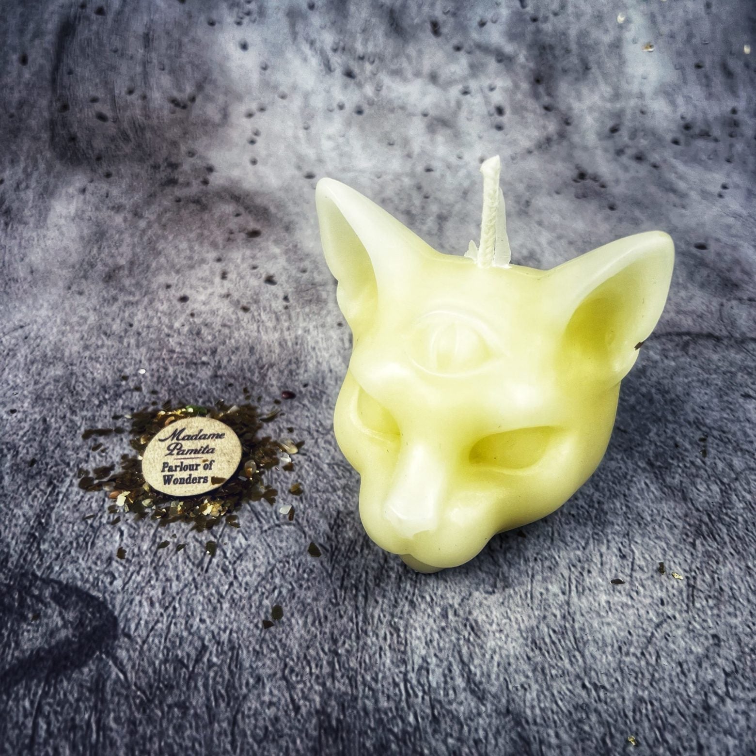 Yellow beeswax psychic cat spell candle by Parlour of Wonders for intuition and clairvoyance magic.