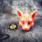 Yellow beeswax psychic cat spell candle by Parlour of Wonders, featuring a feline design for intuition and clairvoyance magic.