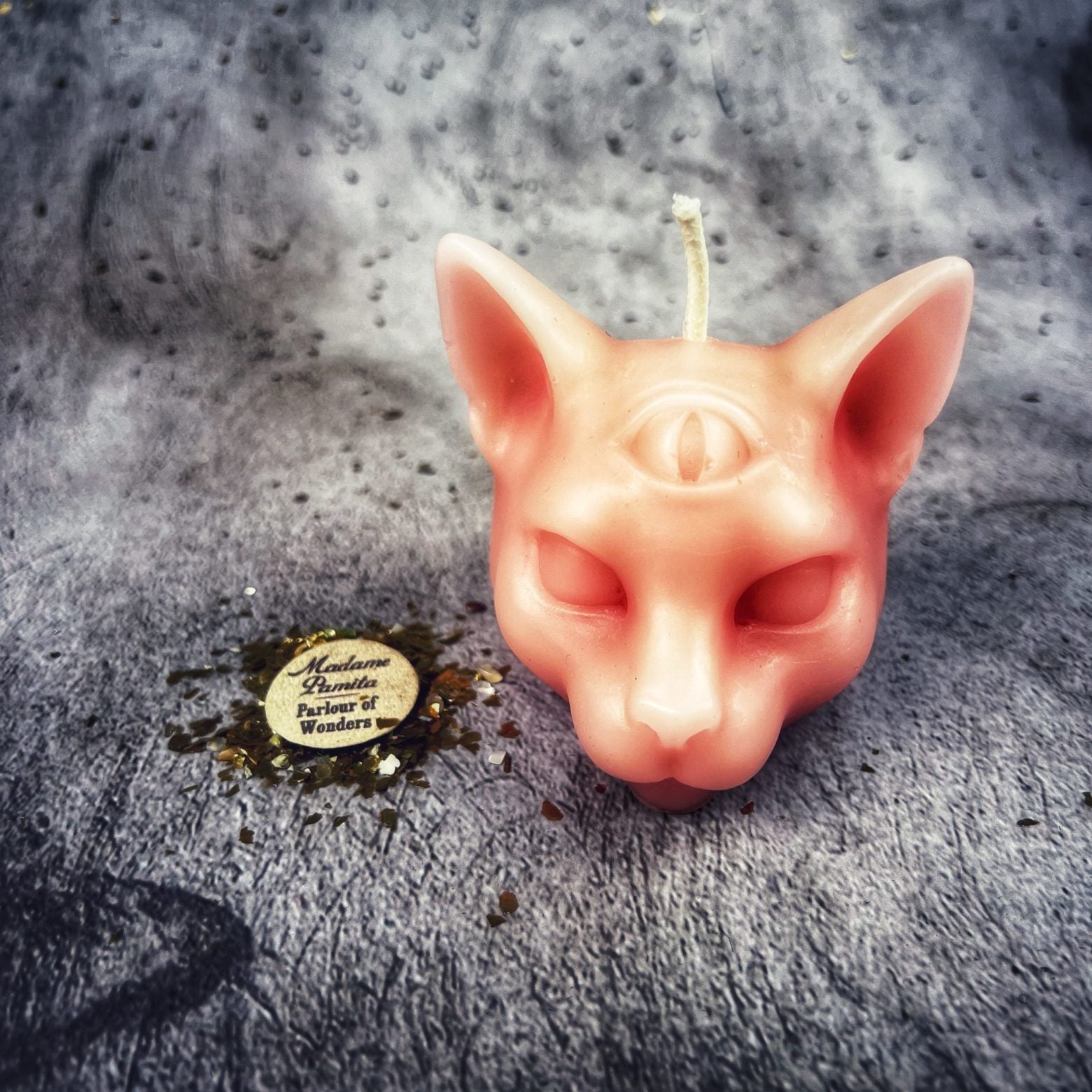 Yellow beeswax psychic cat spell candle by Parlour of Wonders, featuring a feline design for intuition and clairvoyance magic.