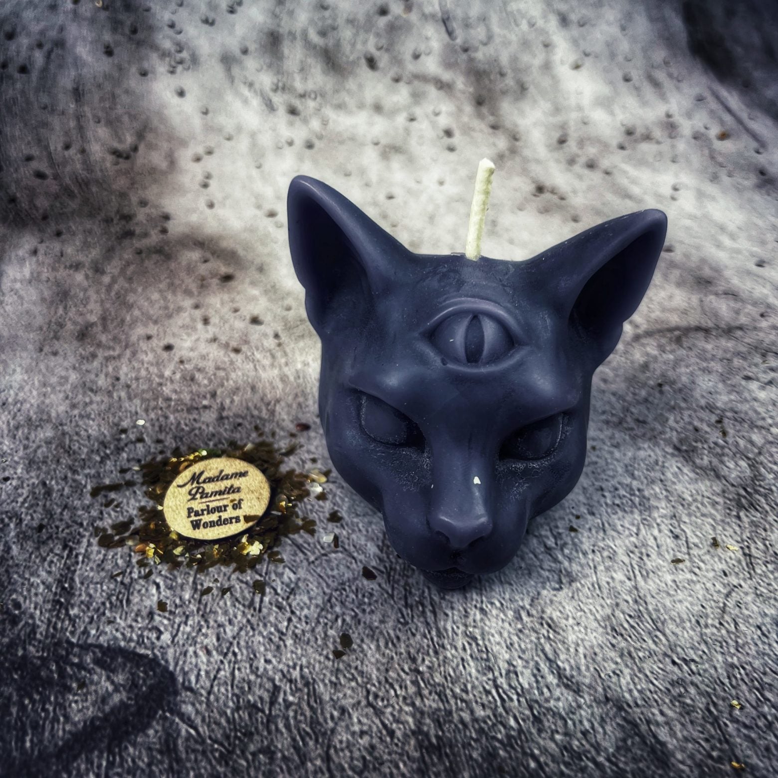 Yellow beeswax psychic cat spell candle by Parlour of Wonders, featuring a feline design for intuition and clairvoyance magic.