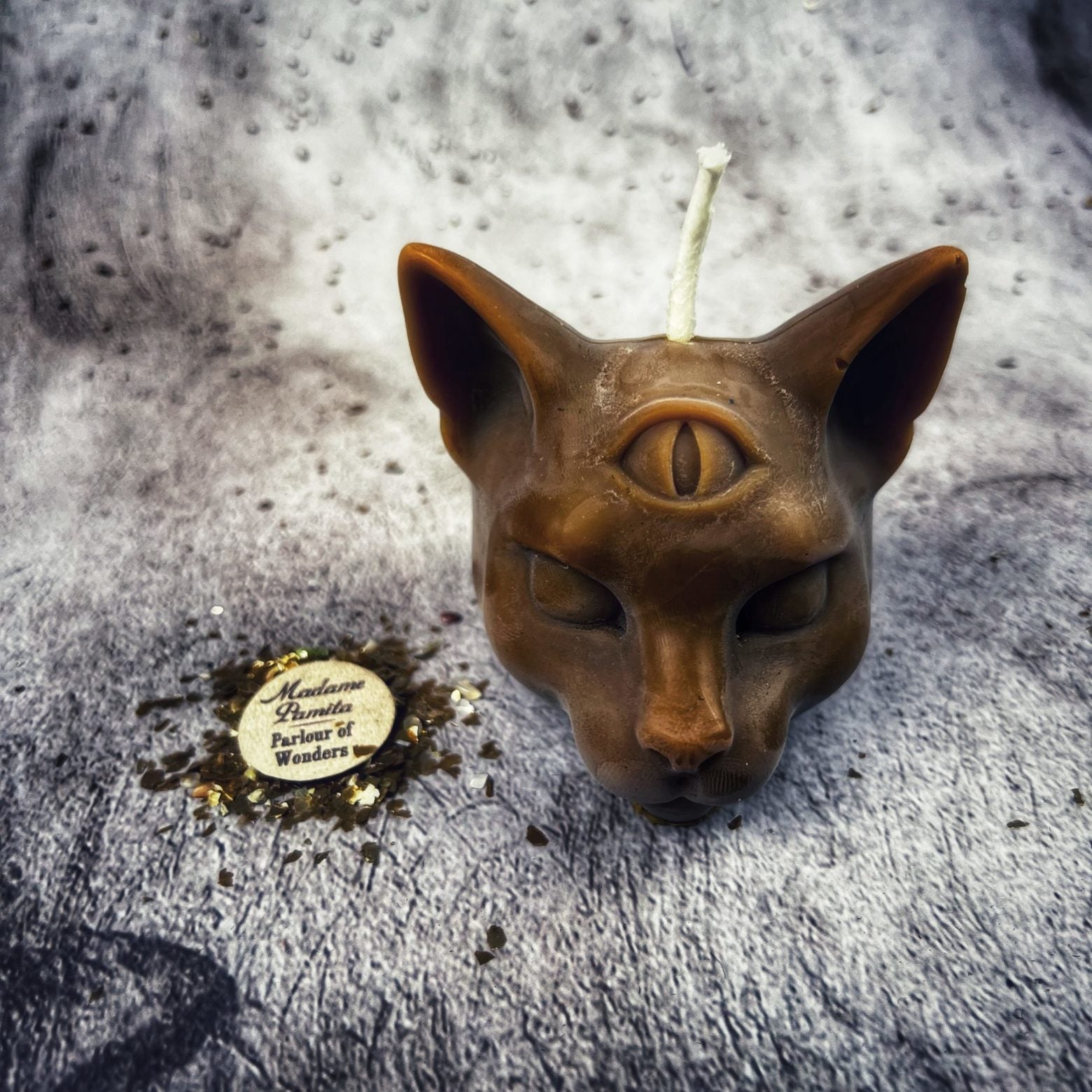 Yellow beeswax psychic cat spell candle from Parlour of Wonders, featuring a mystical cat design for intuition and clairvoyance magic.