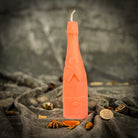 Yellow beeswax candle with a champagne celebration design, perfect for success and luxury manifestation rituals by Parlour of Wonders.