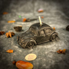 Yellow beeswax candle with charms, designed for safe travels and vehicle protection, by Parlour of Wonders.