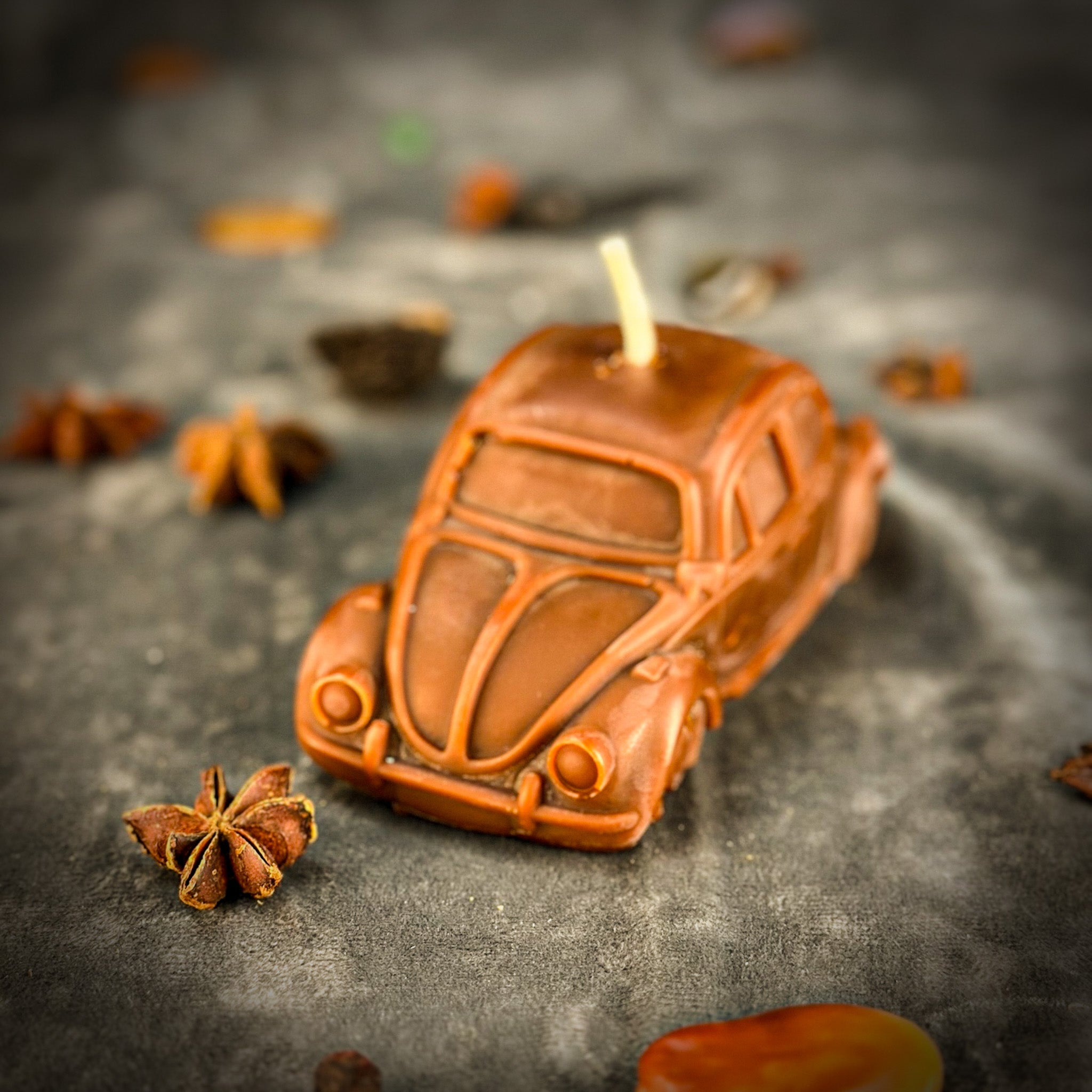Yellow beeswax candle with charms, designed for safe travels and vehicle protection, by Parlour of Wonders.