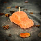 Yellow beeswax car spell candle by Parlour of Wonders, featuring charms for safe travels and vehicle protection.
