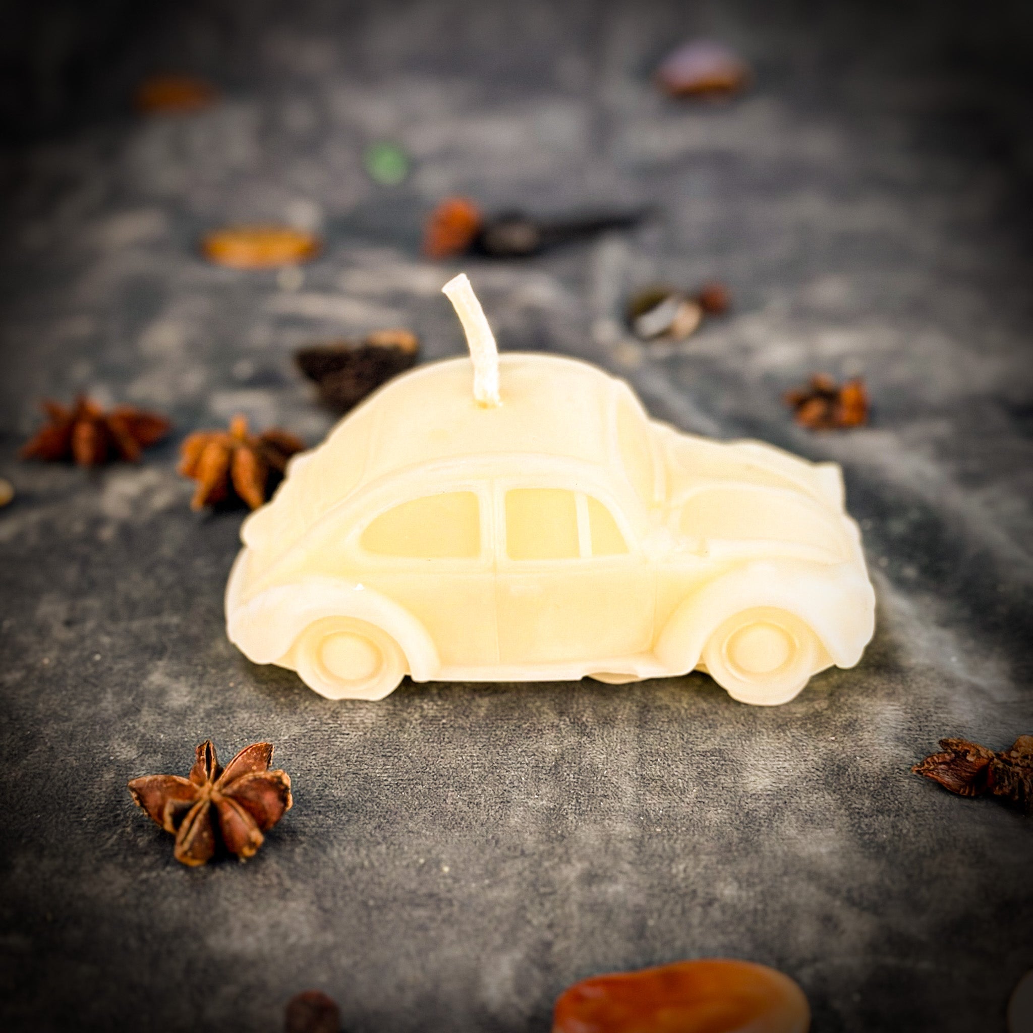 Yellow beeswax car spell candle by Parlour of Wonders, featuring charms for safe travels and vehicle protection.