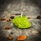 Yellow beeswax candle by Parlour of Wonders with charm for safe travels and vehicle protection, ideal for car spell rituals.