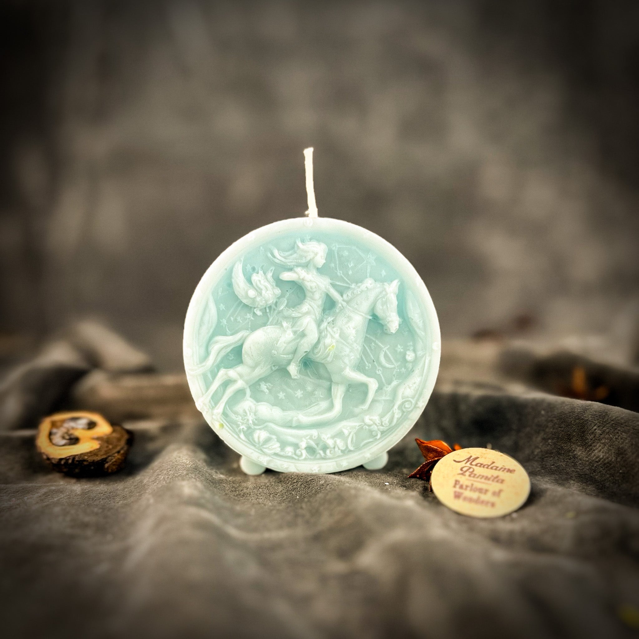 Yellow beeswax Sagittarius Archer zodiac spell candle by Parlour of Wonders, featuring intricate design symbolizing adventure and wisdom.