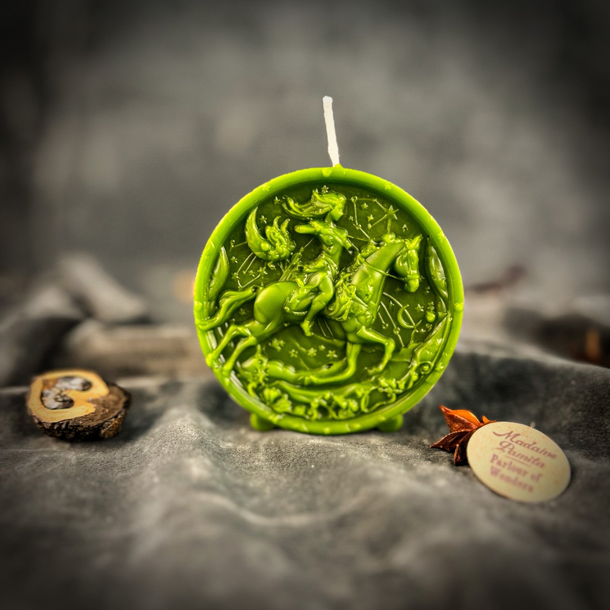 Yellow beeswax Sagittarius Archer zodiac spell candle by Parlour of Wonders, featuring intricate zodiac symbols for wisdom and optimism.