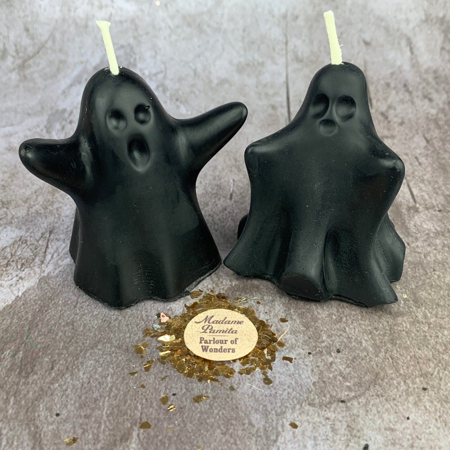 Set of yellow beeswax candles featuring ghost-shaped design for spirit guide and ancestor magic rituals by Parlour of Wonders.