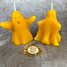 Set of yellow beeswax candles with ghost-shaped designs for spells, spirit guides, and ancestor magic by Parlour of Wonders.