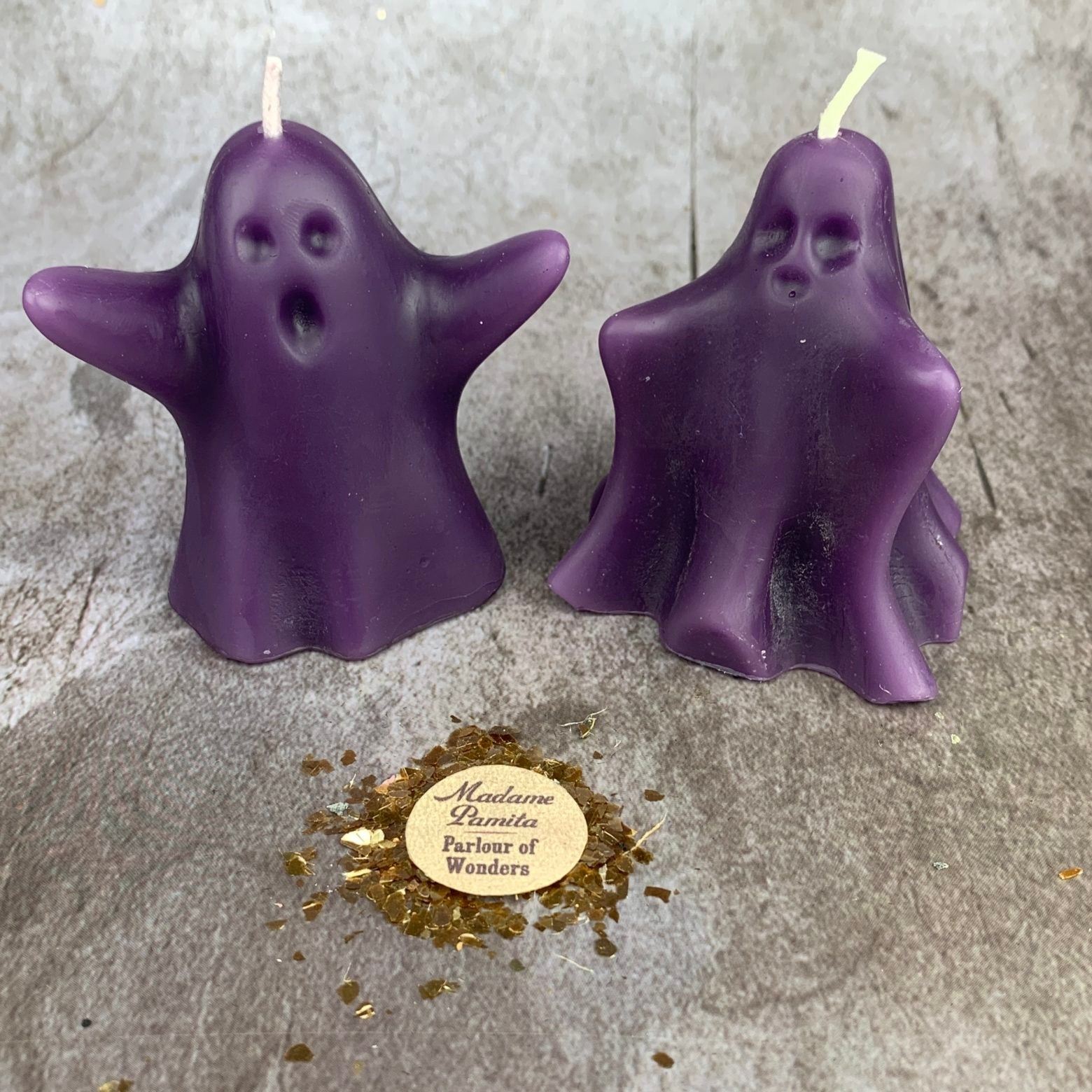 Beeswax Wishing Ghosts spell candle set by Parlour of Wonders, featuring yellow beeswax candles with spirit guide and ancestor magic designs.