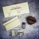 Black Shut Your Mouth Candle Spell Kit by Parlour of Wonders for stopping gossip and silencing rumors, shown with candles and spell ingredients.