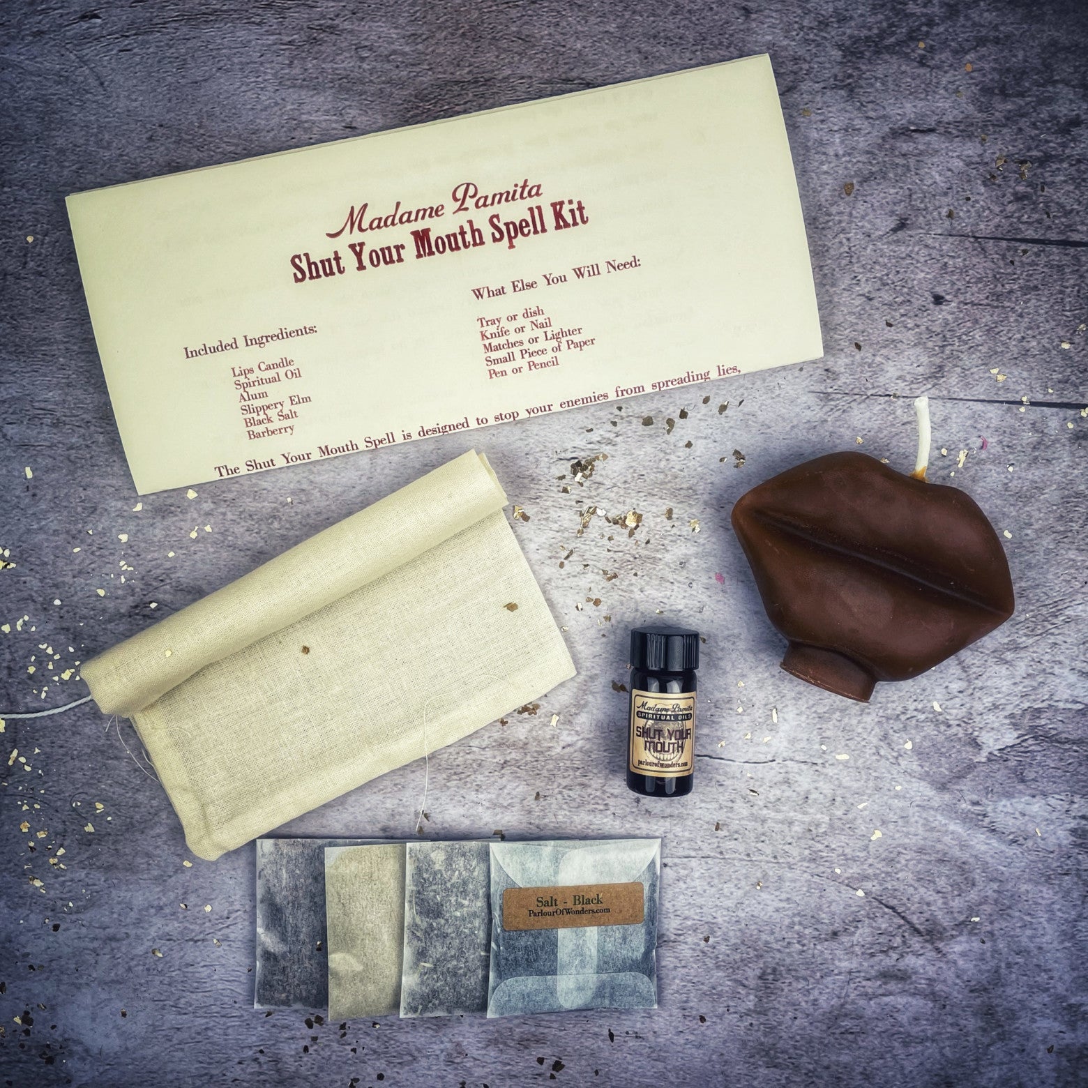 Black Shut Your Mouth Candle Spell Kit by Parlour of Wonders for stopping gossip and silencing rumors, shown with candles and spell ingredients.