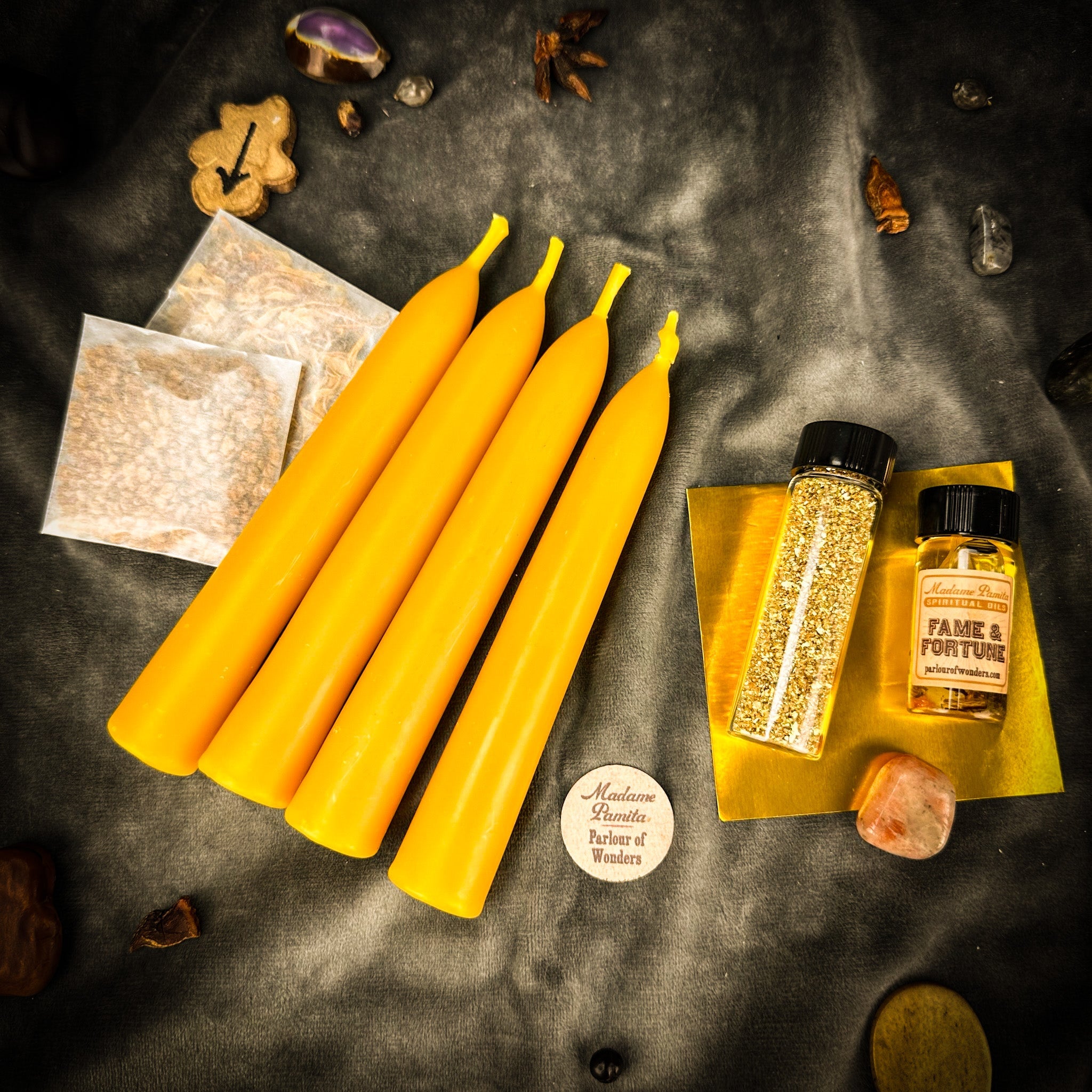 Parlour of Wonders Spotlight Candle Spell Booster Pack with vibrant candles and spell ingredients for fame and fortune.
